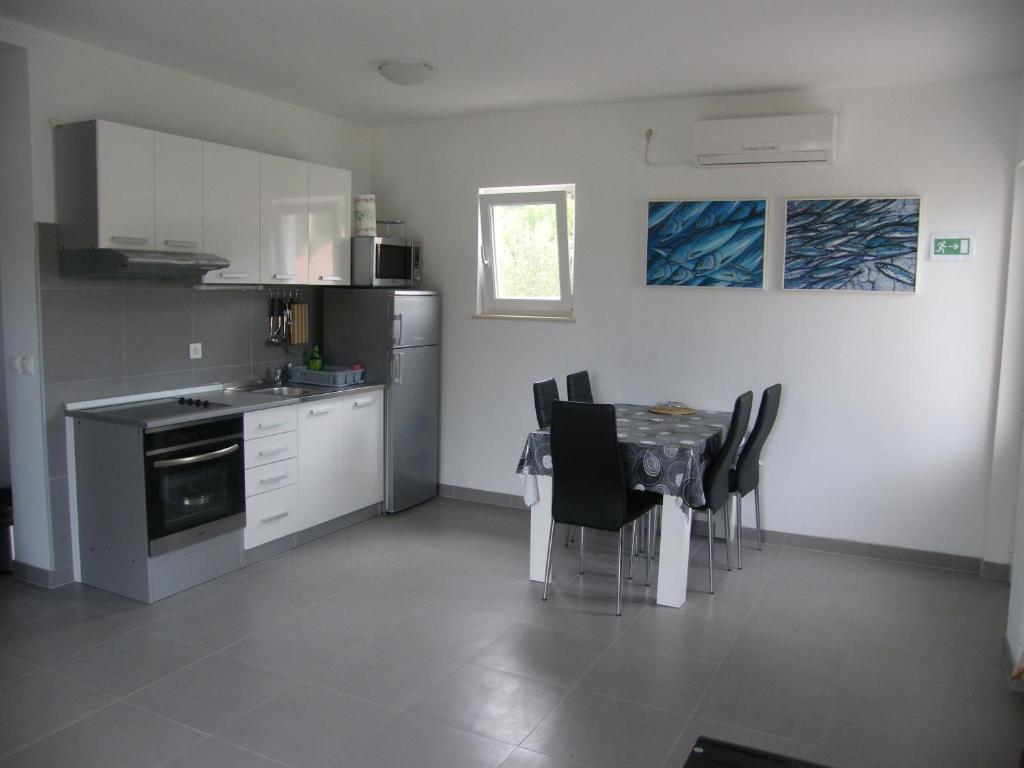 Apartments Maslina Лумбарда Стая снимка
