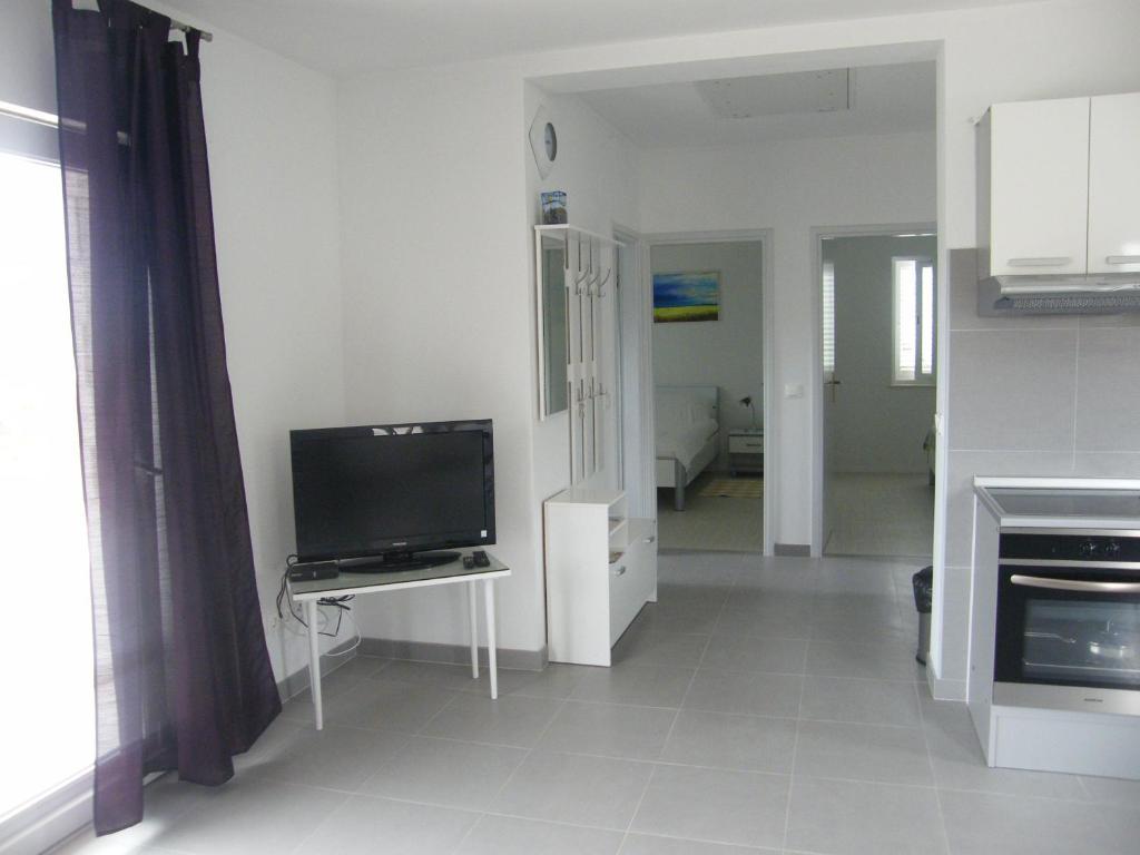Apartments Maslina Лумбарда Стая снимка