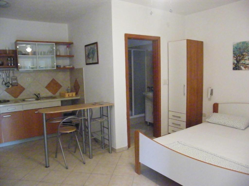 Apartments Maslina Лумбарда Стая снимка